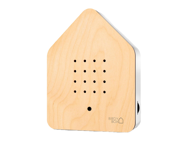 A RELAXOUND Birdybox with a pale maple front, small round speaker holes, a sensor and a white body