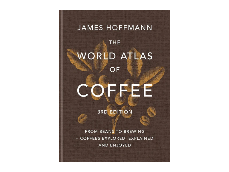 The brown and gold hardcover of The World Atlas of Coffee, third edition, by James Hoffmann