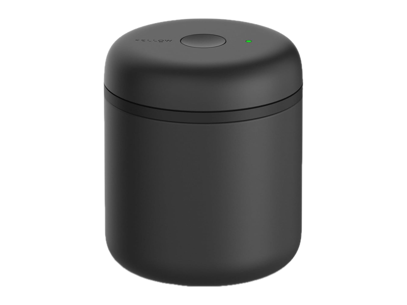 A matte-black Fellow Electric Atmos coffee canister with a button and green indicator on its lid