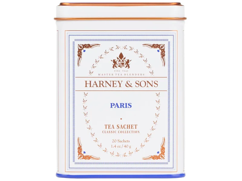 White Harney and Sons Paris tea tin with blue lettering and an orange lid