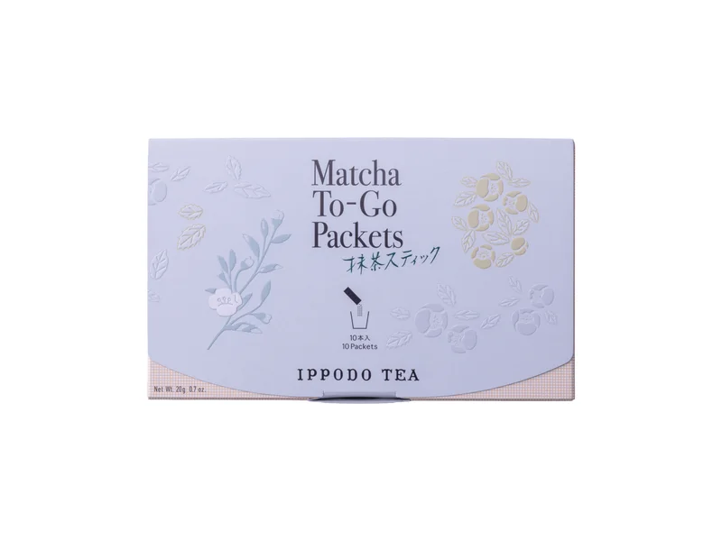 Pale Ippodo Matcha To-Go box with floral artwork and the product name
