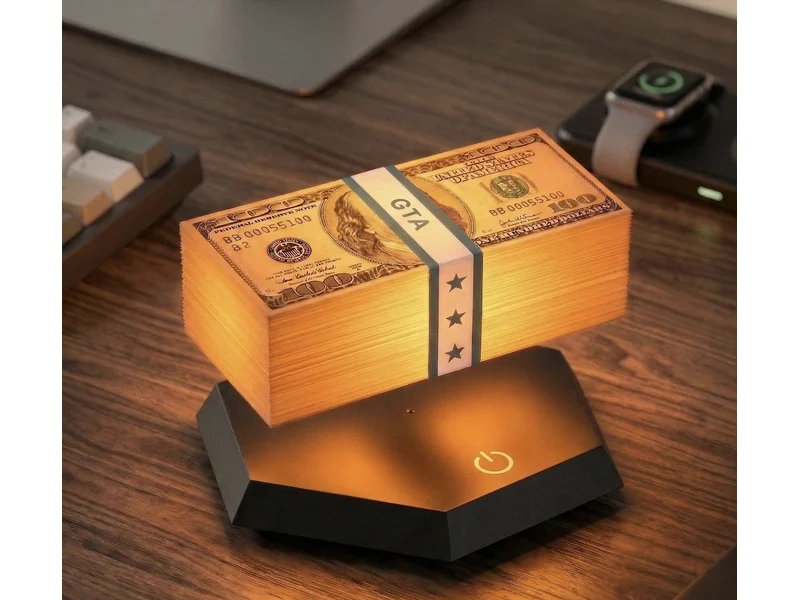 Seller image of a glowing replica money stack floating above a black hexagonal lamp base on a wooden desk; surrounding accessories not included