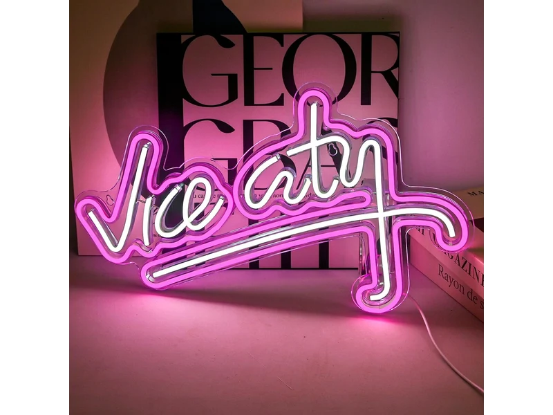 White Vice City script with a pink LED outline on clear backing, photographed against books; books not included