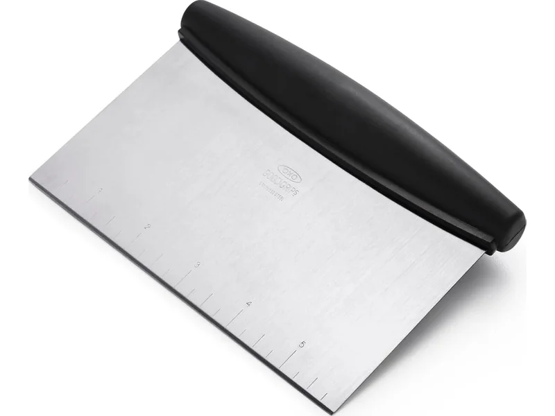 OXO stainless-steel bench scraper with a black handle and measurement markings
