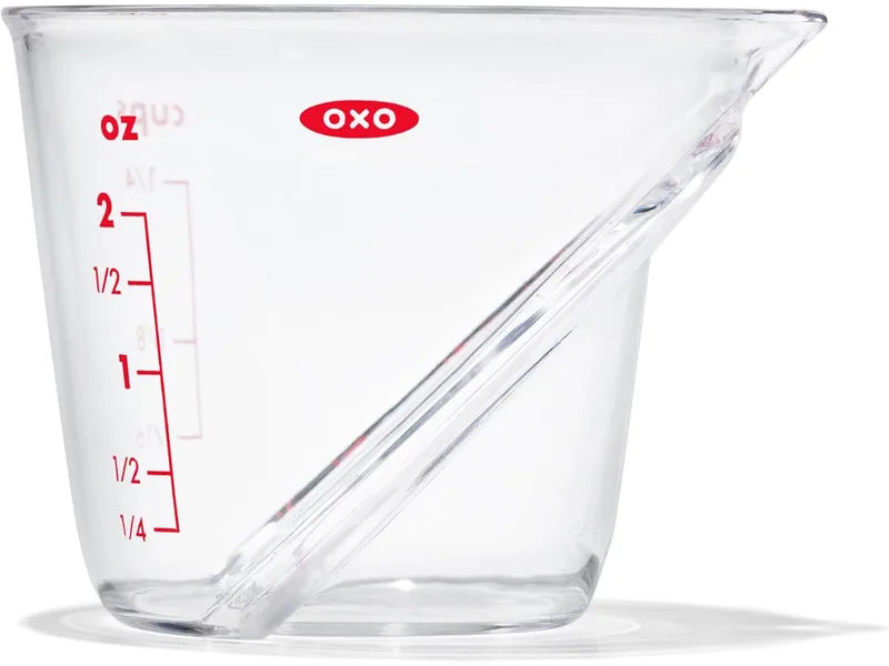Clear OXO mini angled measuring cup with red measurement markings