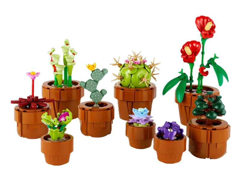 Nine LEGO Tiny Plants models with green leaves and colorful flowers in small terracotta-colored pots