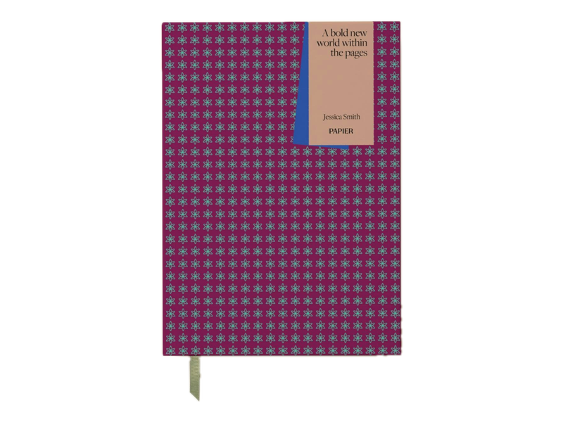 Papier's Bookmarks reading journal with a burgundy and teal pattern, green ribbon and example personalized cover text