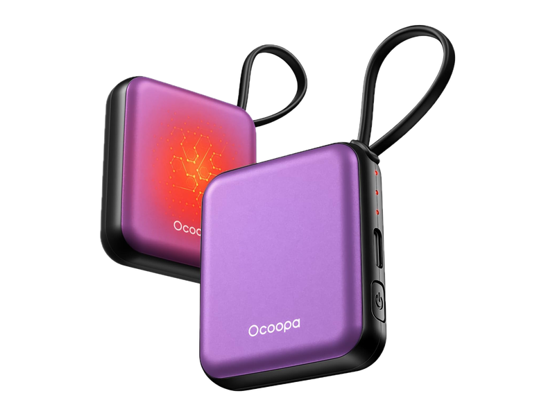 Two purple OCOOPA UT5 Nano hand warmers with black wrist loops; the retailer's image uses an orange glow to illustrate heating